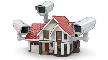 An image of a house that has three security surveillance cameras surrounding the home, for that added visual security on the outside of your home.